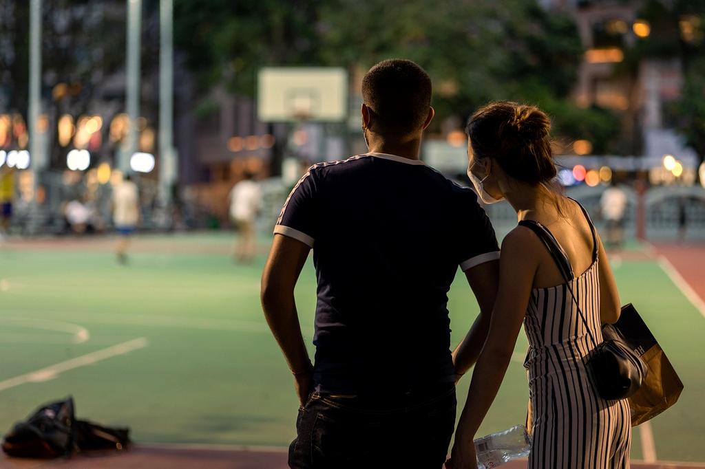 Stylish casual outfit laid out on rustic wooden floor
