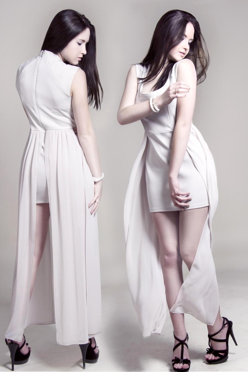 Comfortable casual clothing laid out on bed including jeans and sweaters