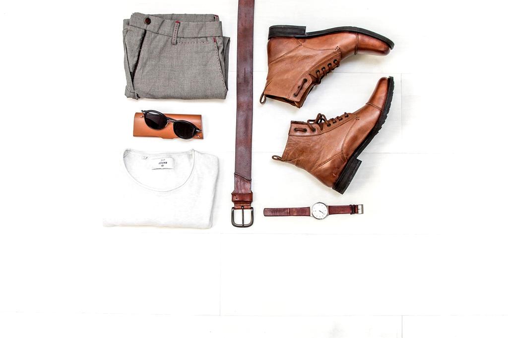 Professional work clothes hanging in organized wardrobe section